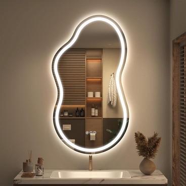 Backlit LED mirror with a soft glowing edge, mounted above a bathroom vanity